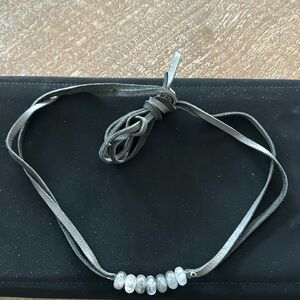 Leather and stone necklace.